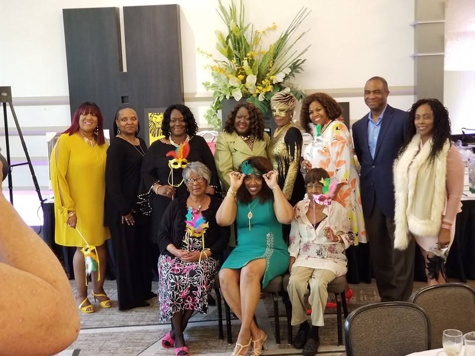 Survivors & Guests with Mardi Gras Masks